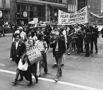 Jeanne Manford marching with her famous sign in a Pride Parade in 1972